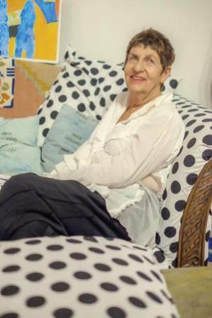 Artist Susan Wick apparently feels right at home at the opening reception for her exhibition at BMoCA. (Richard Peterson / Courtesy of BMoCA)