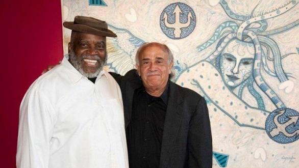 López Oliva con Georges Nnamdi en la exposición de Detroit