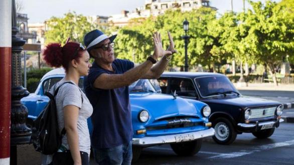 Filming in the streets of Havana. Arturo Santana, director and Iris Abreu, assistant director