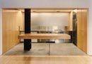  The kitchen opens up completely toward the waiting room and is spruced up with a counter partially perched on the projecting wall