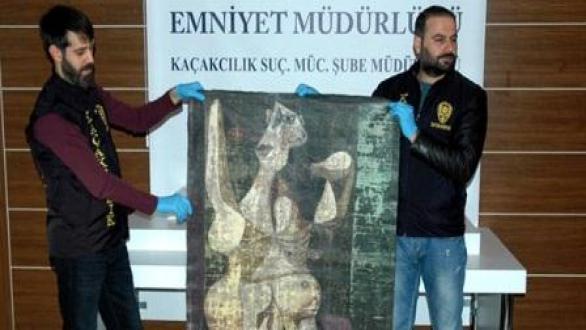 Turkish police from the Istanbul Police Department's Anti-Smuggling and Organized Crime Unit unveiled the painting. Photo: STR/AFP/Getty Images